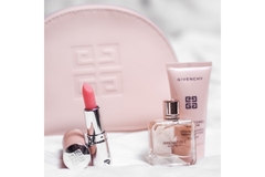 Givenchy products on a white bedsheet.